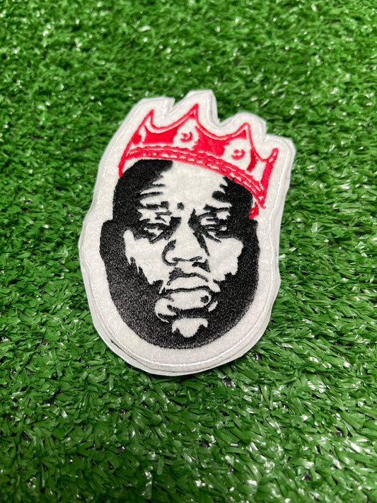 Custom embroidered patch of the Notorious BIG wearing a red crown stitched in black, white, and red thread.