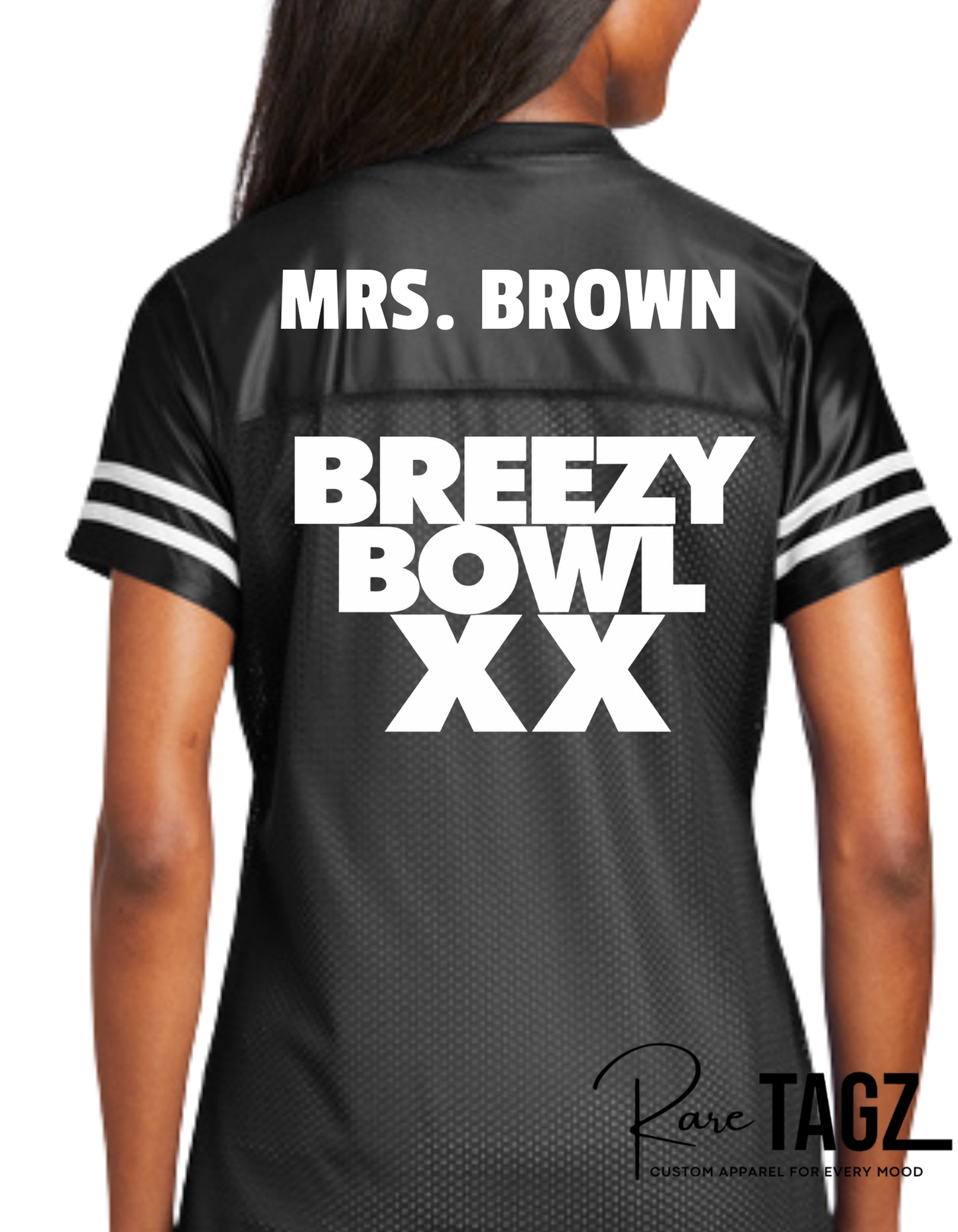 Black sports jersey with 'Mrs. Brown' and 'Breezy Bowl XX' text, worn by a person.