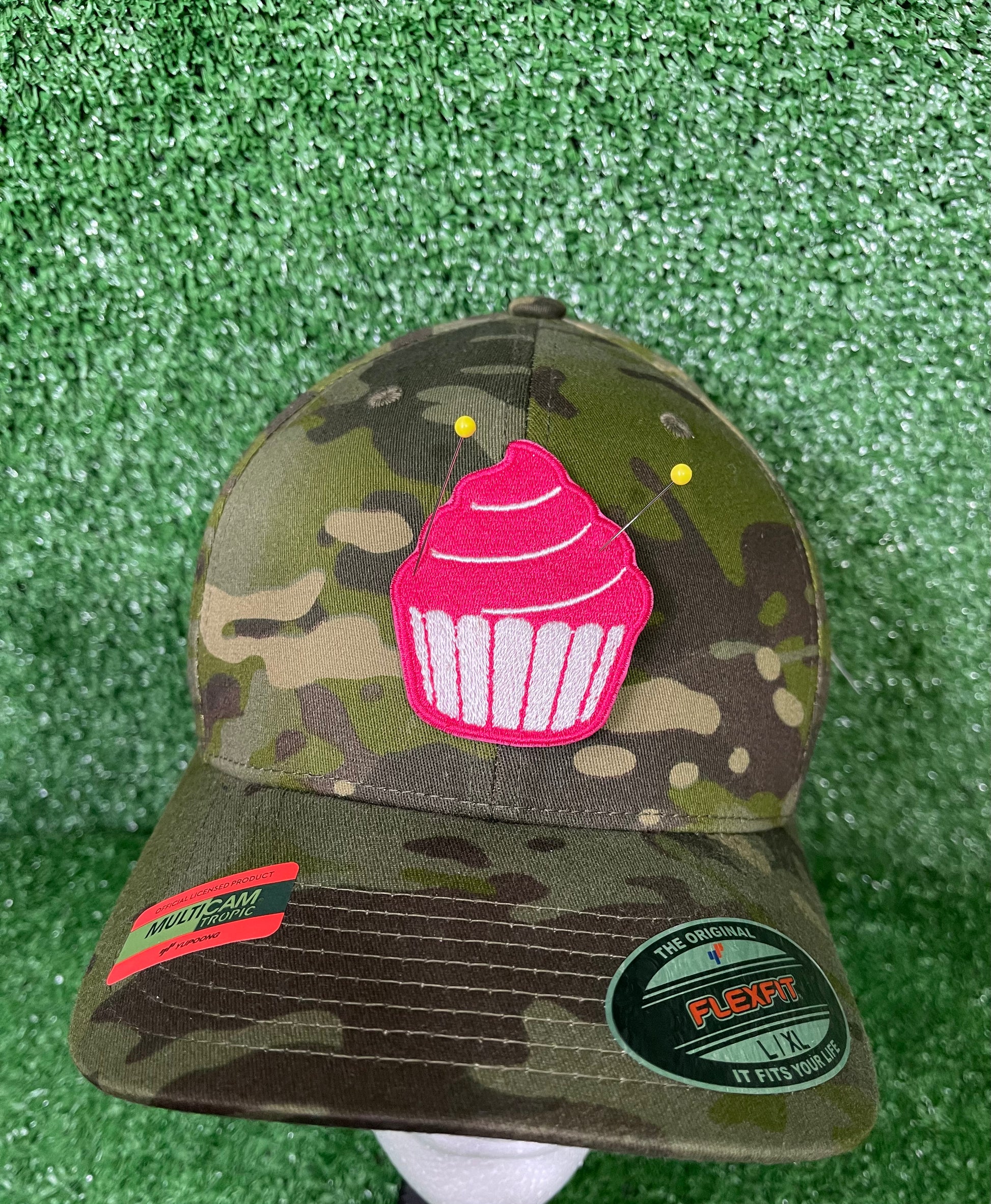 Embroidered iron on patch featuring a colorful cupcake design, perfect for personalizing jackets, bags, or accessories for baking enthusiasts and sweet treat lovers.