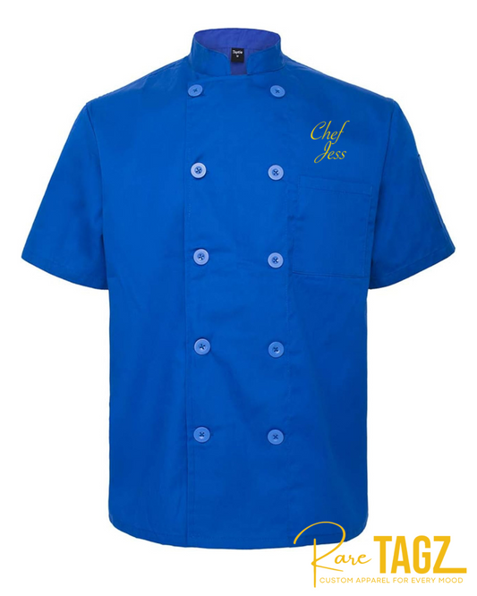 Blue embroidered chef coat with "Chef Name" on left chest, designed for professionals who want to showcase their brand.