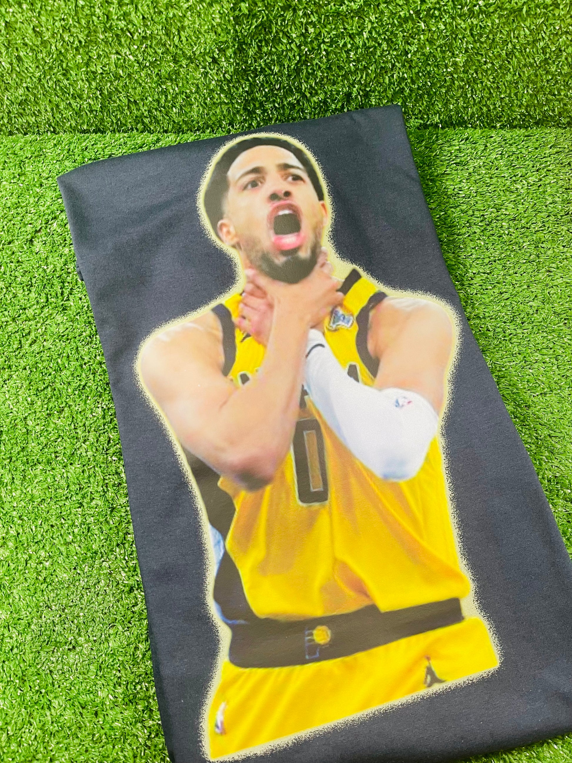 Tyrese Haliburton in a yellow Pacer jersey mid celebration, gripping his neck with both hands in a passionate playoff moment, against a blurred arena crowd.