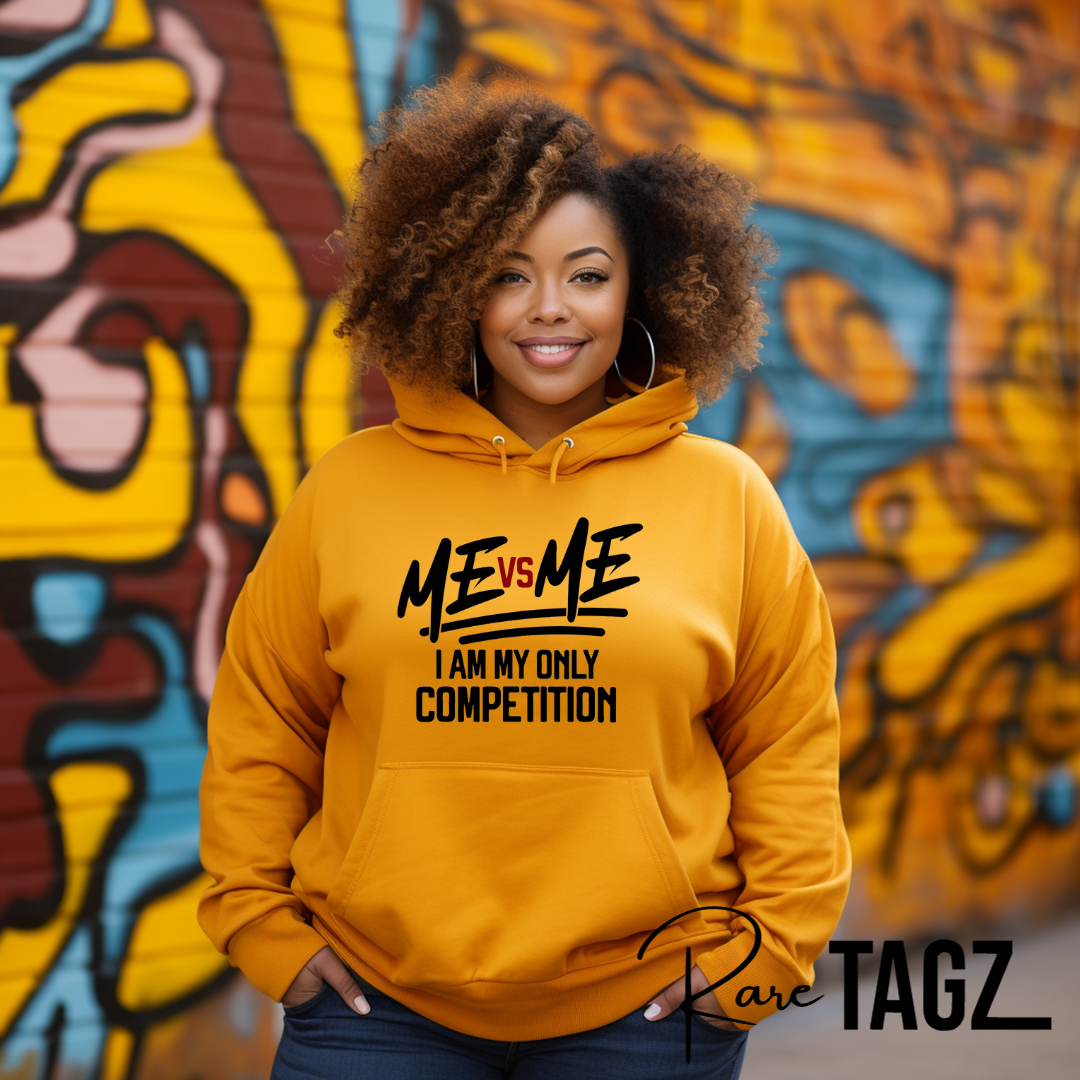 Bold yellow hoodie featuring the empowering phrase “ME vs ME – I Am My Only Competition” in striking black and red lettering. Perfect for those who embrace self-improvement and personal growth. Made from premium fabric for comfort and style.