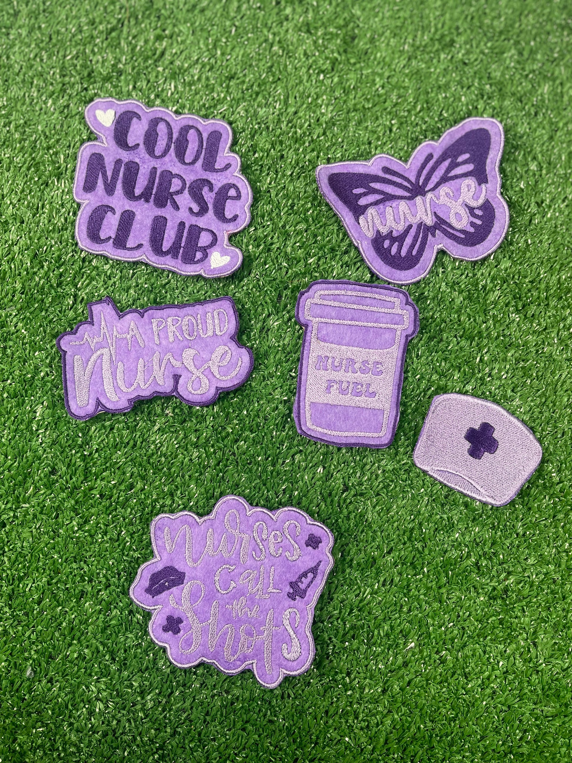 Purple nurse-themed embroidered iron-on patch set featuring six designs: 
Cool Nurse Club
A Proud Nurse
Nurse Fuel Coffee Cup
Nurse Cap 
Butterfly with Nurse script
Nurses Call the Shots phrase