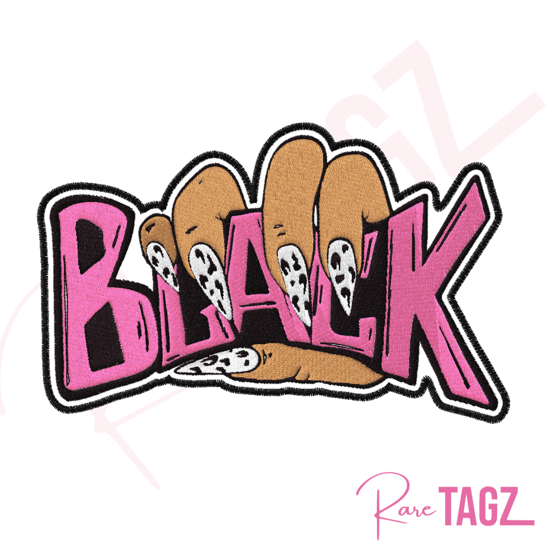 Embroidered iron-on patch featuring the word Black held by a hand with stylish-black and white nails. The letters Black are embroidered in bold pink stitching.