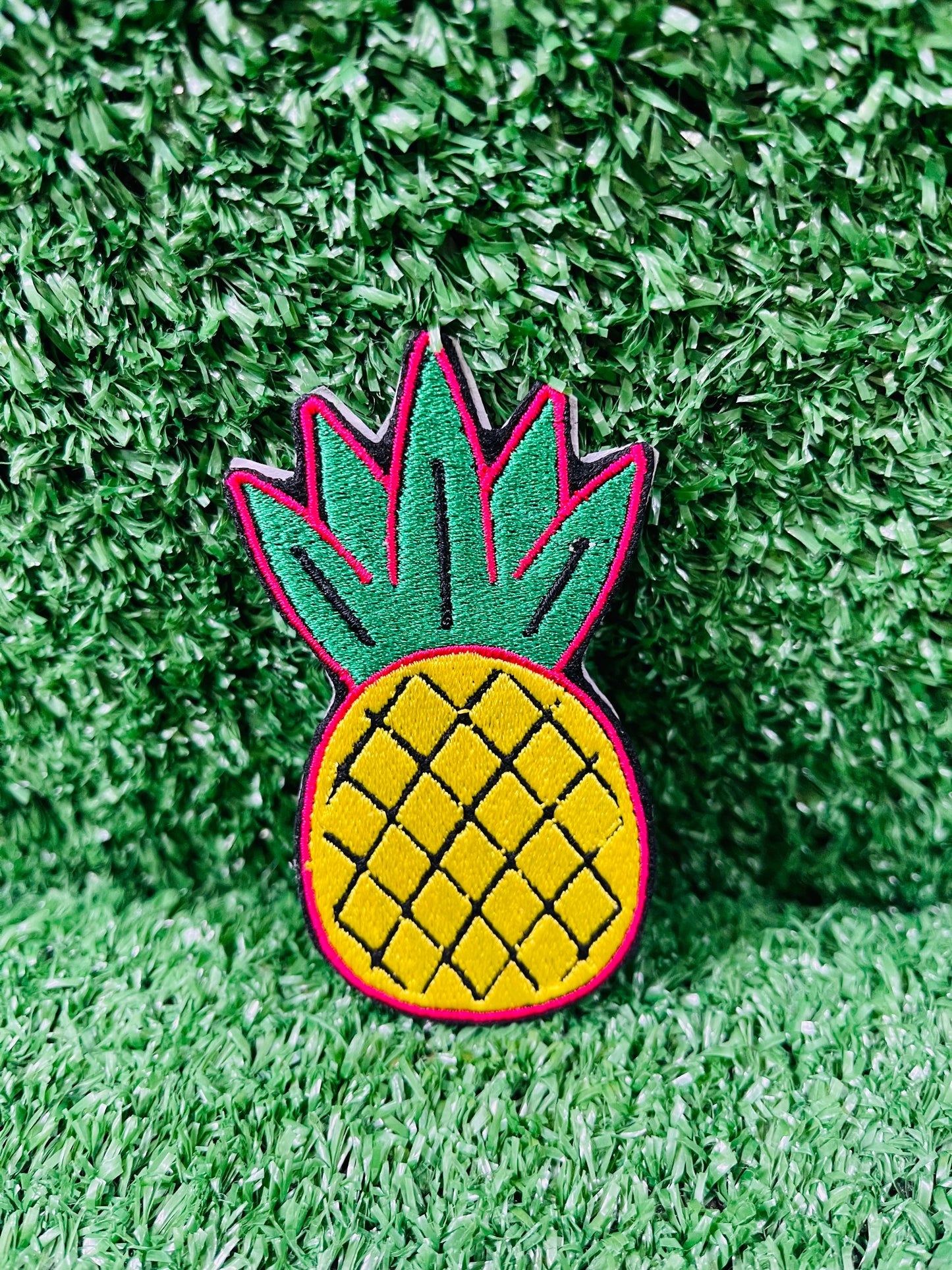 Pineapple-shaped patch on green grass
