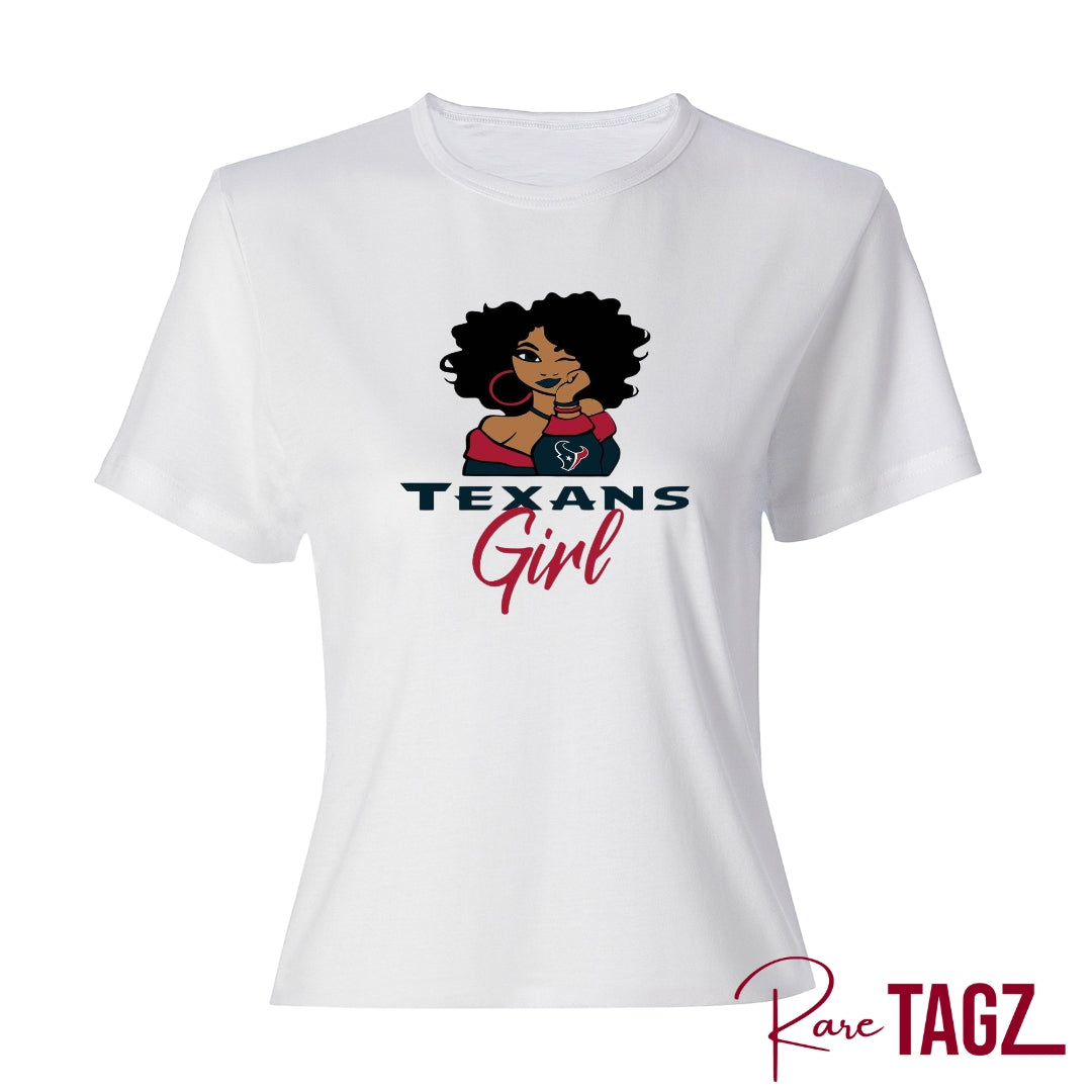 Stylish and comfortable t-shirt featuring a bold 'Texans Girl' graphic in vibrant colors. Made from a soft and durable cotton blend, this tee provides all-day comfort. It's perfect for proud Texas women who want to showcase their state pride in a fashionable way. The shirt pairs well with jeans, shorts, or skirts, making it ideal for casual outings and everyday wear. Available in various sizes to fit all body types, this Texans Girl T-Shirt is a must-have for any Texas enthusiast.