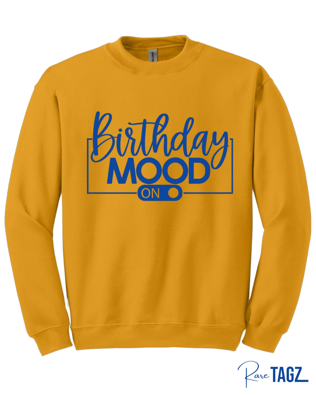 Bold gold crewneck sweatshirt featuring the phrase Birthday Mood On in stylish white lettering with an on-switch graphic. This cozy and festive birthday sweatshirt by Rare Tagz is perfect for birthday celebrations, photo ops, and turning up your birthday energy in style.