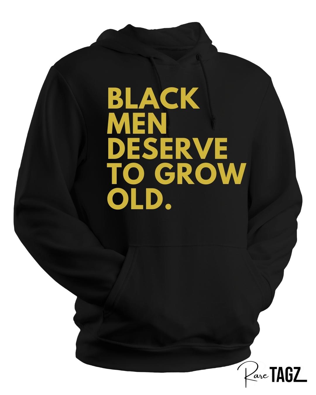Unisex black hoodie with bold old gold text reading black men deserve to grow old a powerful statement hoodie for Father's Day or everyday wear to honor Black fathers and men.