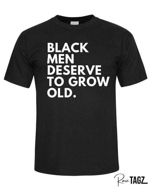 Unisex black t-shirt with bold white text reading black men deserve to grow old a powerful statement tee for Father's Day or everyday wear to honor Black fathers and men.