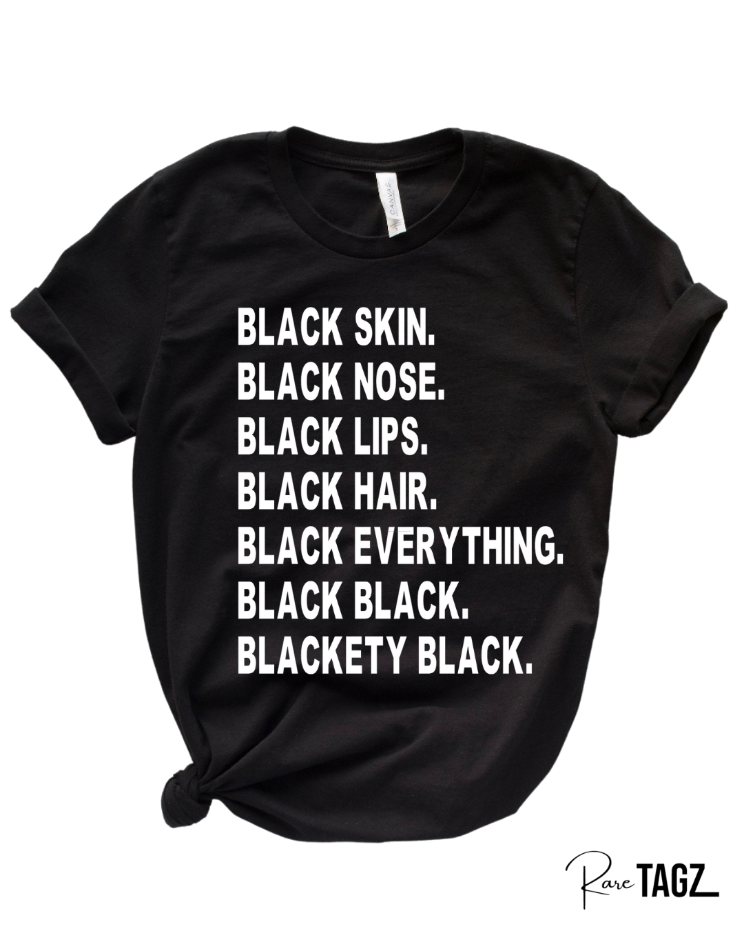 Black t-shirt with bold white text that reads Black Skin Black Nose Black Lips Black Hair Black Everything Black Black Blackety Black Designed By Rare Tagz