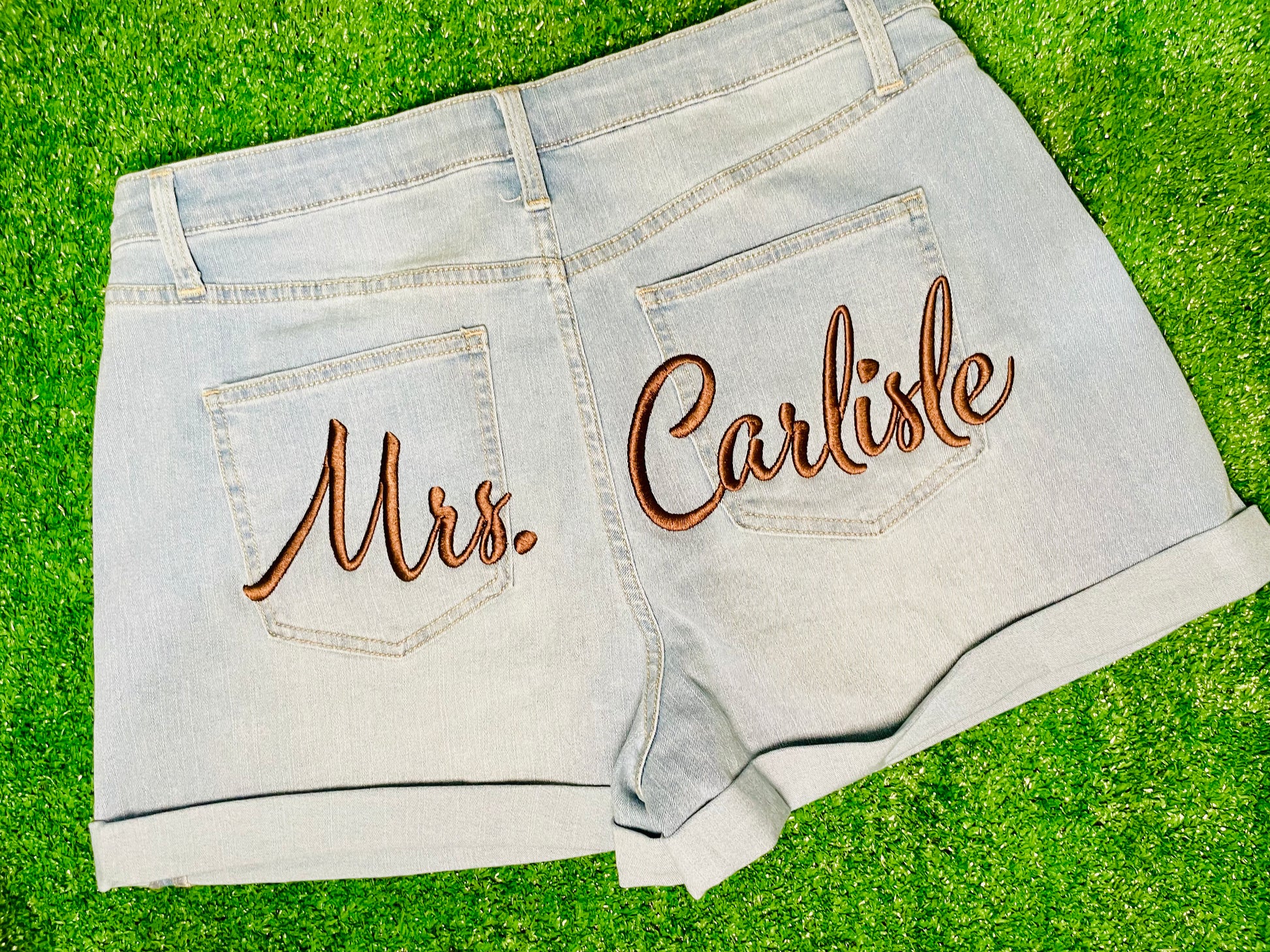 Custom denim shorts with custom embroidery on the back, perfect for birthdays, baecations, wedding, girls trips, and special events.