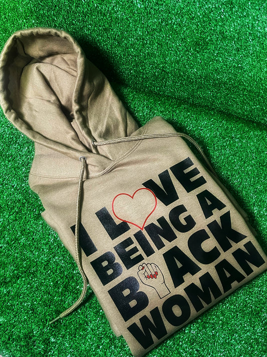 A stylish and comfortable hoodie with the empowering phrase 'I Love Being a Black Woman' boldly printed on the front. Perfect for showcasing pride, confidence, and cultural identity. Ideal for casual wear, this hoodie celebrates black womanhood and is perfect for those who want to make a bold statement. Great for layering in cooler weather, and a must-have for anyone proud of their heritage.