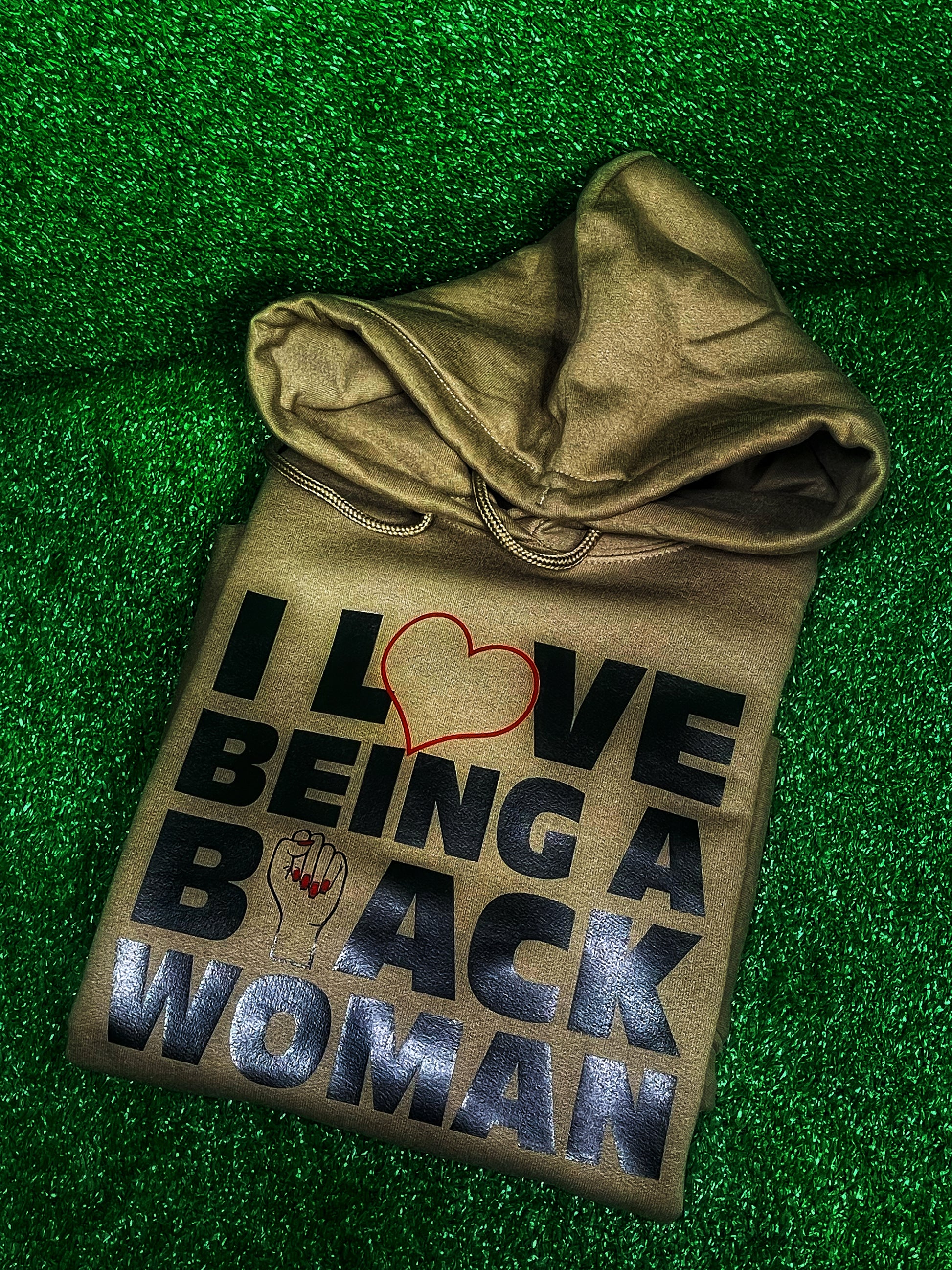A stylish and comfortable hoodie with the empowering phrase 'I Love Being a Black Woman' boldly printed on the front. Perfect for showcasing pride, confidence, and cultural identity. Ideal for casual wear, this hoodie celebrates black womanhood and is perfect for those who want to make a bold statement. Great for layering in cooler weather, and a must-have for anyone proud of their heritage.
