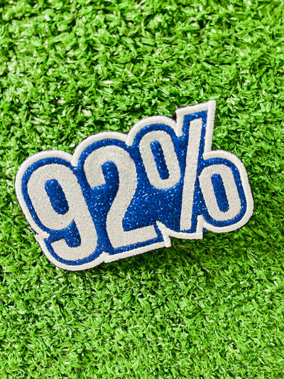 A striking '92%' embroidered iron-on patch celebrating the impactful role of Black women voters in the 2024 election. This patch features vibrant colors and high-quality stitching, designed for easy application on jackets, bags, hats, and other fabric items. Perfect for showcasing pride and support with a bold, empowering statement.