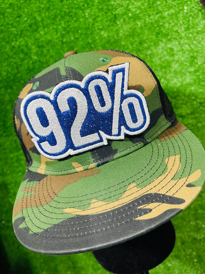 A striking '92%' embroidered iron-on patch celebrating the impactful role of Black women voters in the 2024 election. This patch features vibrant colors and high-quality stitching, designed for easy application on jackets, bags, hats, and other fabric items. Perfect for showcasing pride and support with a bold, empowering statement.