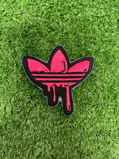 Adidas iron-on patch featuring the iconic three stripes logo.