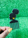 Silhouette of a woman with a natural bun, wearing a gold earring, incorporated into an afro pick design; green black embroidery with bold detailing.