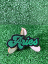 Embroidered iron-on patch with the word Aries in a bold decorative font.