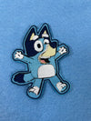 Bluey cartoon character iron-on patch with vibrant colors and playful design.