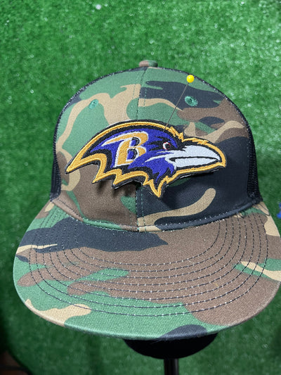 Detailed view of a Baltimore Ravens patch showcasing the team's raven head logo with striking colors, perfect for customizing jackets, trucker hats, or bags with team pride.