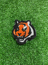 Embroidered Bengal Tiger iron-on patch featuring a detailed and vibrant design of a majestic Bengal Tigers face. Perfect for jackets, backpacks, hats, and clothing. Embroidered iron-on patch featuring the Bengals logo with bold colors and stitching.