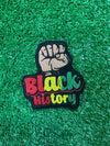 Bold and empowering iron-on patch featuring a raised fist symbol. Perfect for celebrating Black history and expressing solidarity, this high-quality embroidered patch adds a powerful statement to jackets, backpacks, hats, and other clothing items.