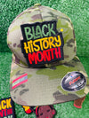 An image of custom Black History Month patches featuring vibrant, bold designs that celebrate Black culture, heritage, and achievements. The patches include empowering phrases, colorful Afrocentric patterns, and symbols of unity and pride. Each patch is intricately embroidered, showcasing high-quality craftsmanship and thoughtful design, perfect for honoring Black History Month on clothing, bags, or accessories.