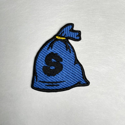 Embroidered patch depicting a money bag with a dollar sign, featuring blue, black and gold colors for a bold and eye-catching design.