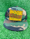 Bold and trendy iron-on patch featuring the phrase 'Book Club Baddie' in stylish lettering. Perfect for book lovers, this high-quality embroidered patch showcases vibrant colors and intricate stitching, ideal for adding a literary flair to jackets, backpacks, hats, and other clothing items.