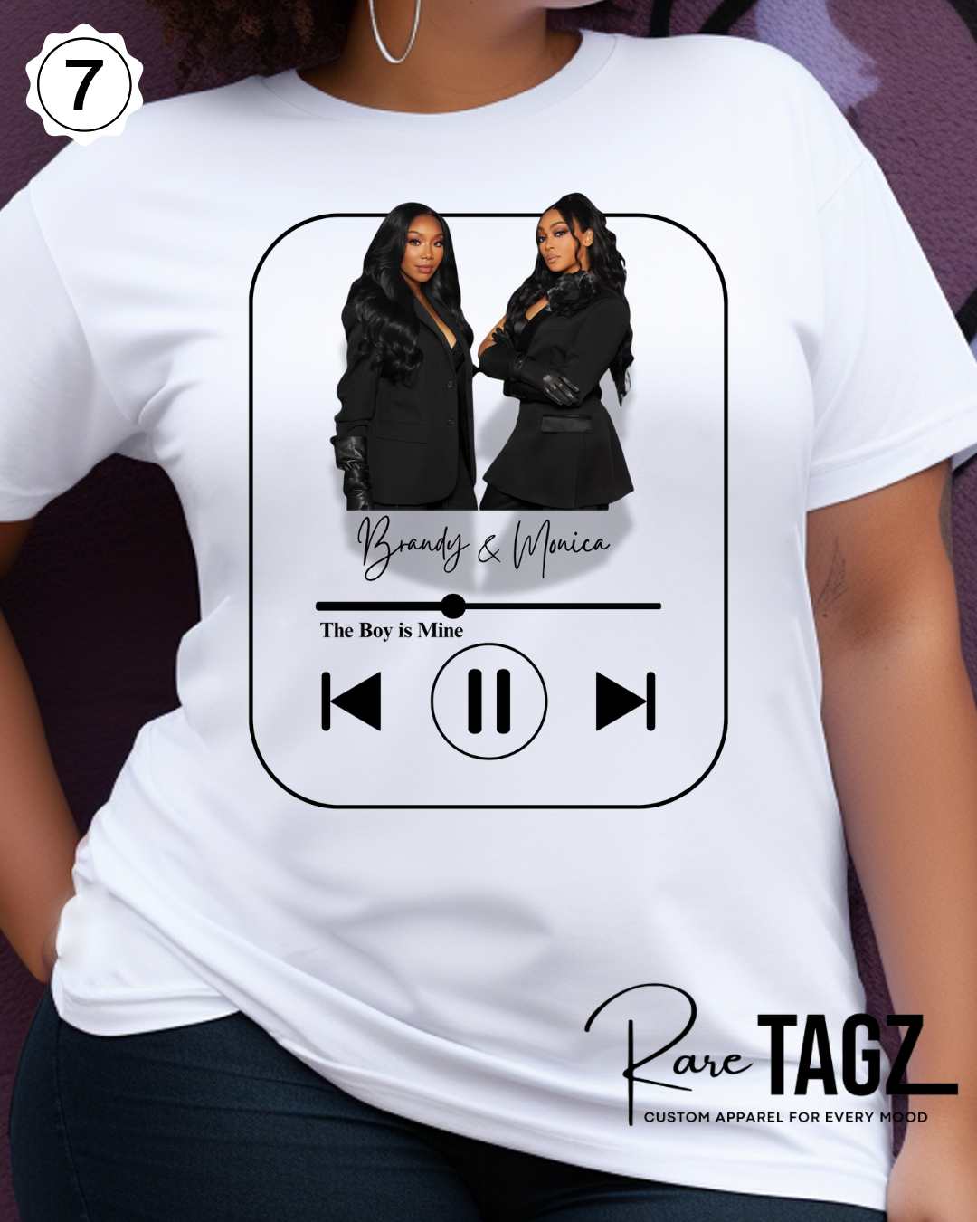 Woman wearing a white t-shirt with graphic design of Brandy and Monica and text that reads The Boy is Mine.  Promoting the Boy is Mine Tour.
