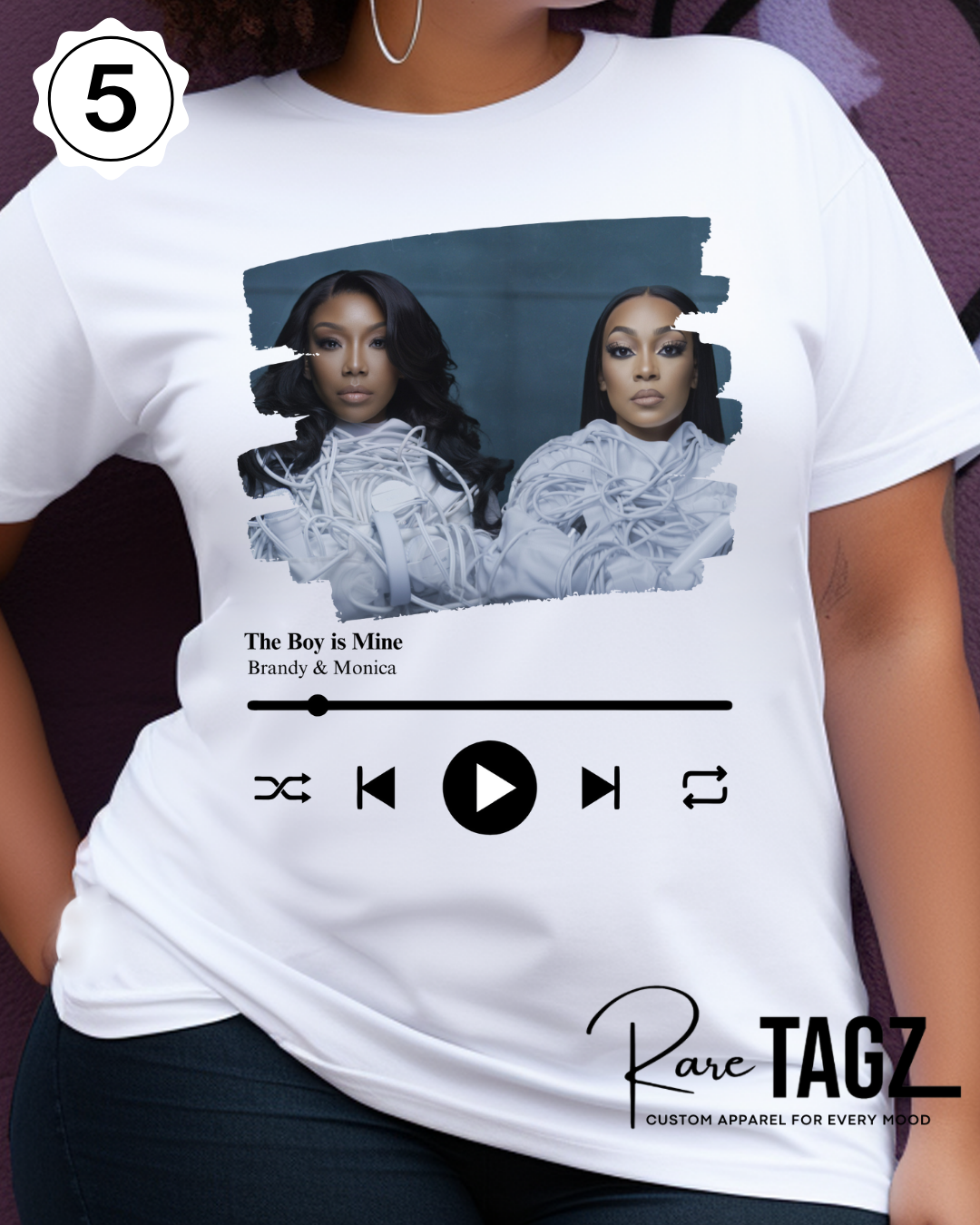 Woman wearing a white t-shirt with graphic design of Brandy and Monica and text that reads The Boy is Mine.  Promoting the Boy is Mine Tour.