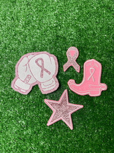 Breast Cancer Awareness Patch set featuring a cowboy boo with a breast cancer ribbon, a glitter star, boxing gloves with ribbon, and shimmering glitter ribbon patch.