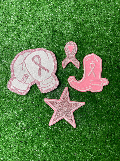 Breast Cancer Awareness Patch set featuring a cowboy boo with a breast cancer ribbon, a glitter star, boxing gloves with ribbon, and shimmering glitter ribbon patch.