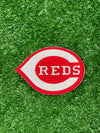 CINCINNATI REDS IRON-ON PATCH FEATURING THE ICONIC RED C LOGO WITH WHITE EMBROIDERY ON A VIBRANT RED BACKGROUND.