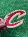 A close-up of a Cleveland Cavaliers patch featuring the teams letter C. Perfect for add a bold, sporty touch to jackets, trucker hats, or bags.