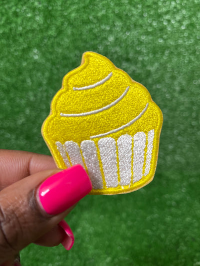 Embroidered iron on patch featuring a colorful cupcake design, perfect for personalizing jackets, bags, or accessories for baking enthusiasts and sweet treat lovers.