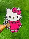 A set of four embroidered patches displayed on bright green grass. The set includes a white kitty wearing a pink hoodie, and holding an iced coffee, a pink bow, a green flower with a yellow center, and a pink flower with a yellow center. The patches are digitized and embroidered with high-quality stitching.