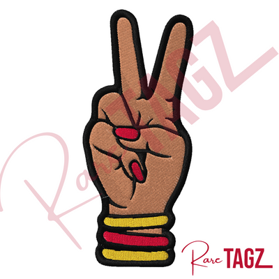 Custom embroidered Deuces patch depicting a hand with two fingers raised in a peace sign adorned with bangles and matching nails.