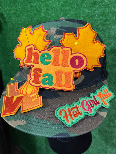 A set of 5 fall themed patches including Hello Fall, Hot Girl Fall, and Love with a pumpkin as the O. The bundle also features two leaf designs.