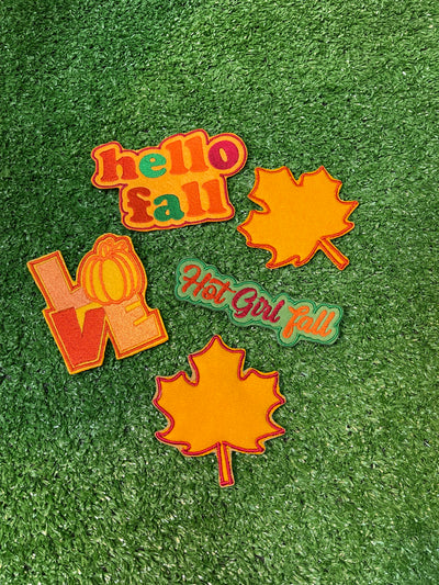 A set of 5 fall themed patches including Hello Fall, Hot Girl Fall, and Love with a pumpkin as the O. The bundle also features two leaf designs.