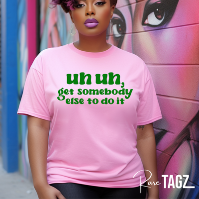 A stylish t-shirt featuring the bold text 'Uh Uh, Get Somebody Else to Do It.' Made from a soft, durable cotton blend, this shirt is available in multiple colors and sizes from XS to 4XL. The eye-catching design is perfect for expressing a sassy, no-nonsense attitude, making it a great addition to any wardrobe.