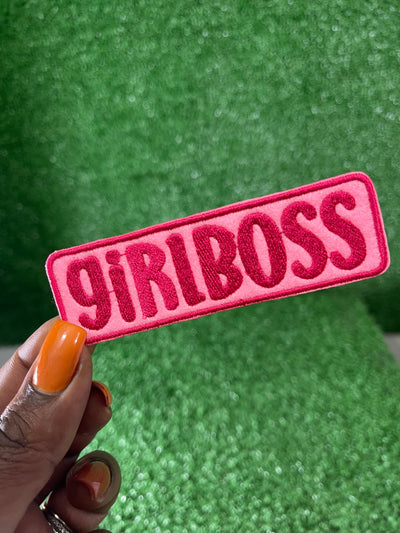 Embroidered iron-on patch that reads GIRLBOSS in bold, stylish pink letters, perfect for adding an empowering touch to jackets, bags, or trucker hats.