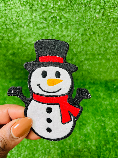 Charming and festive iron-on patch featuring a cheerful snowman design covered in shimmering glitter. Perfect for adding sparkle to jackets, backpacks, hats, and other clothing items, bringing a touch of holiday cheer to your wardrobe.