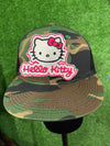 A close up of a Hello Kitty patch featuring the character's signature bow and face, ideal for adding a cute and playful touch to clothing or accessories.