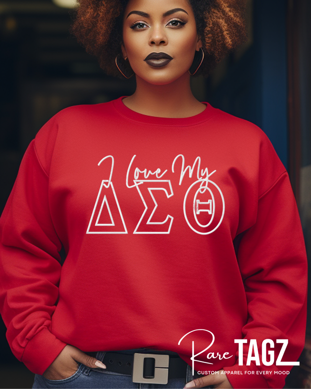 Person wearing a red sweatshirt with 'Love My Delta Sigma Theta' design, standing against a blurred background.