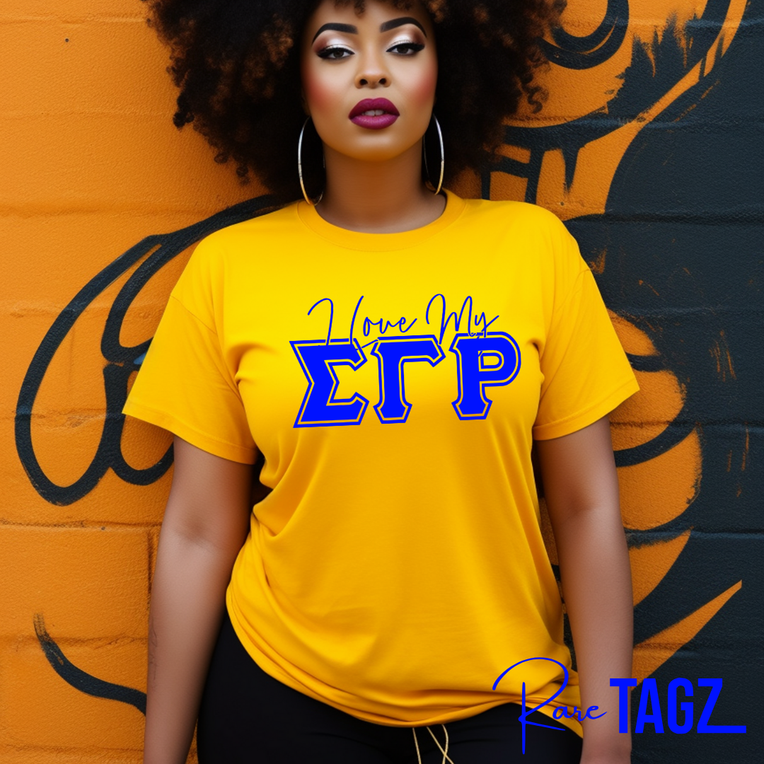 A woman wearing a blue t-shirt with 'I Love My SGRho' printed in yellow text.