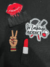 Vibrant makeup artist-inspired patches featuring red lipstick tube and makeup brushes to showcase beauty and artistry.