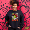 Customizable sweatshirt featuring a playful 'Mama Grinch' design. The sweatshirt can be personalized with the names of kids, making it a unique and festive piece. Perfect for moms looking to celebrate the holiday season with a touch of fun and personalization.