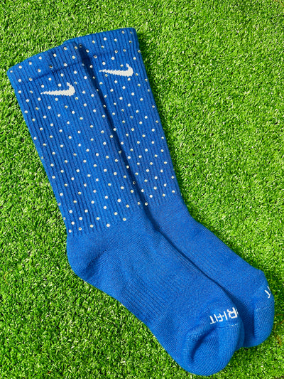 Blue Nike socks embellished with sparkling rhinestones, adding a touch of bling and style.  The socks feature a bold blue color with rhinestones carefully placed for a dazzling effect, perfect for elevating any sneaker look.