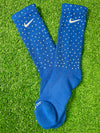 Blue Nike socks embellished with sparkling rhinestones, adding a touch of bling and style.  The socks feature a bold blue color with rhinestones carefully placed for a dazzling effect, perfect for elevating any sneaker look.